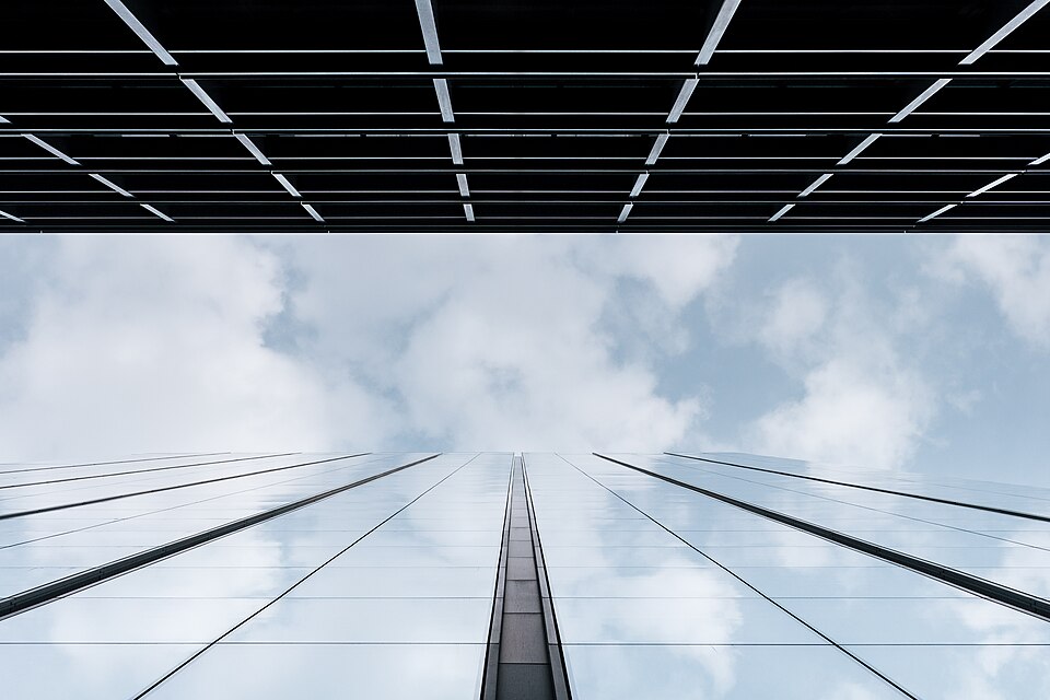 Commercial glass tower reflecting the sky