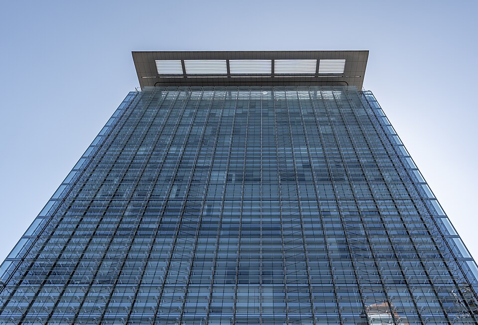 Modern office building exterior viewed from below